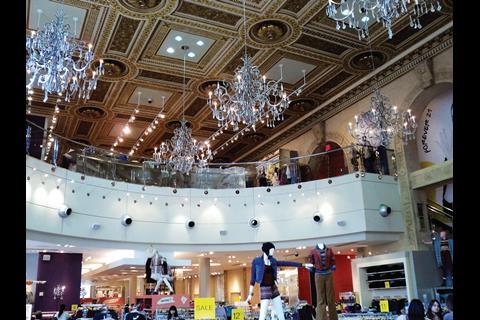 The Forever 21 store was previously a bank and boasts a dramatic mezzanine with multiple chandeliers for glitz
